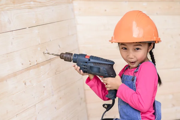 Little Carpenter Girl Work Portrait Holding Drill Wood Background — Stock Photo, Image