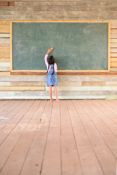 Kid Earasing Old Green Chalkboard Wood Floor — Stock Photo, Image
