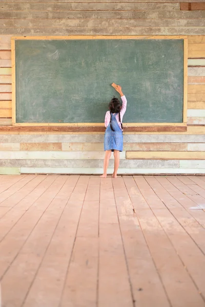 Kid Earasing Old Green Chalkboard Wood Floor — Stock Photo, Image