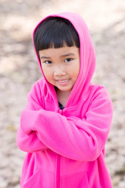 Asian kid in pink jacket with emotion — Stock Photo, Image
