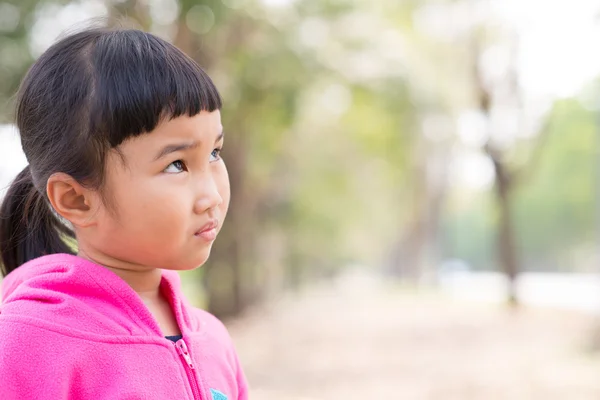 Asian kid in pink jacket with emotion — Stock Photo, Image