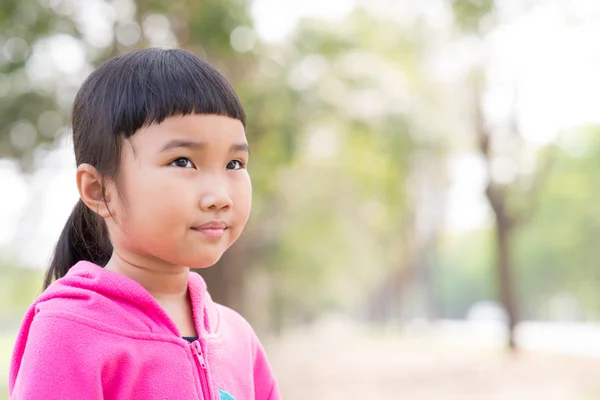 Asian kid in pink jacket with emotion — Stock Photo, Image