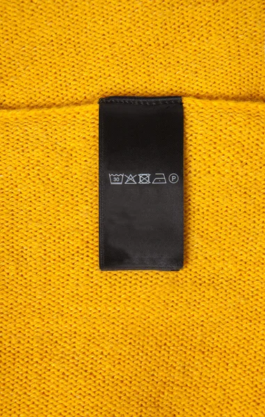 Washing label on cloth — Stock Photo, Image