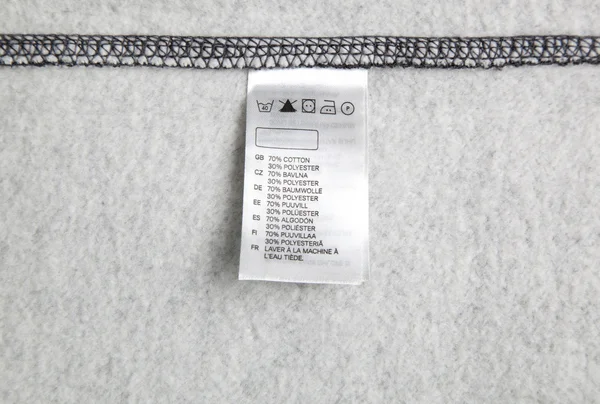 Washing label on cloth — Stock Photo, Image