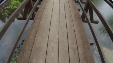 Tahta bir köprüyü geçerek, daha küçük bir nehrin üzerinde, bahar havası ve doğayla çevrili bir patika. 