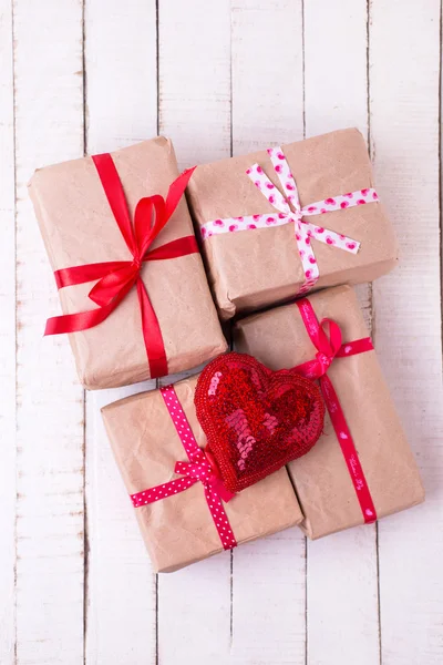 Gift boxes and decorative heart — Stock Photo, Image