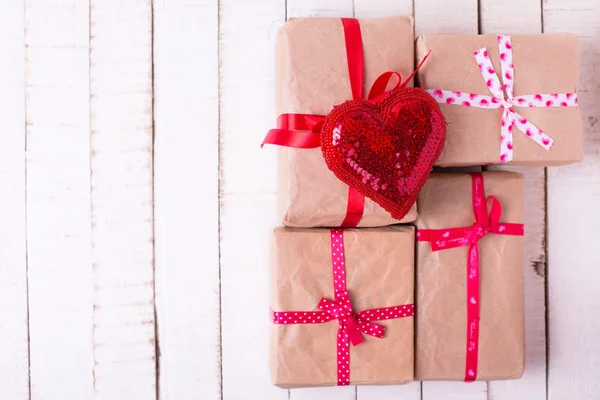 Gift boxes and decorative heart — Stock Photo, Image