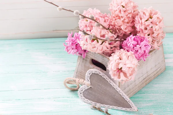 Pink hyacinths in box and decorative heart — Stock Photo, Image