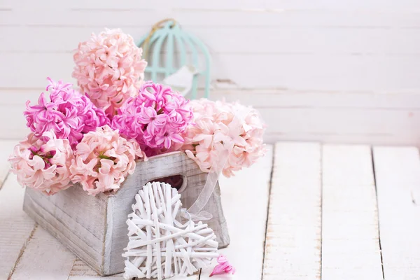 Pink hyacinths in box and decorative heart — Stock Photo, Image