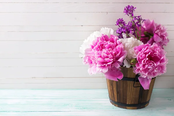 Fresh peony flowers in bucket — Stock Photo, Image