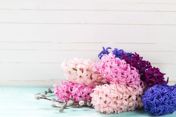 Hyacinths and willow on wooden planks — Stock Photo, Image