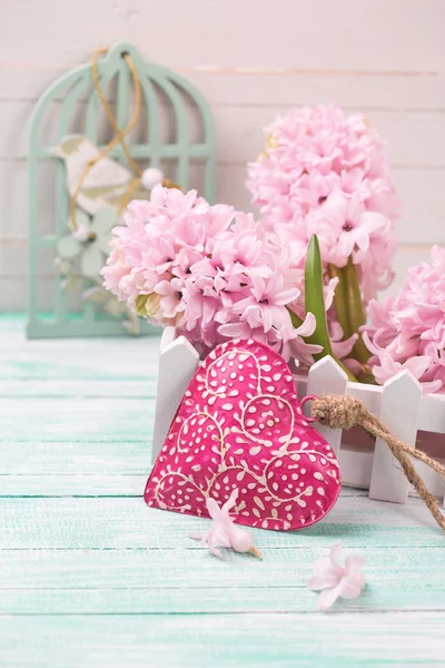 Hyacinths flowers and decorative red heart — Stock Photo, Image