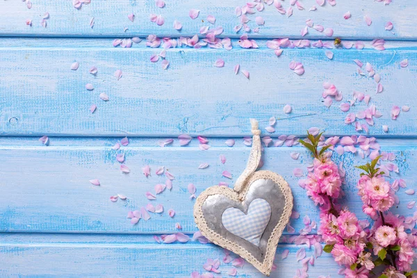 Elegant pink flowers and decorative heart — Stock Photo, Image