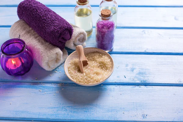 Sea salt with towels and oil — Stock Photo, Image