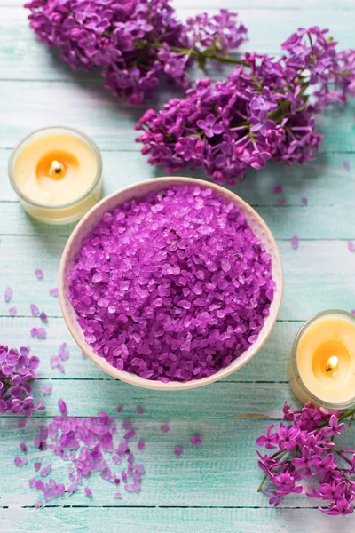 Sea salt in bowl with candles — Stock Photo, Image