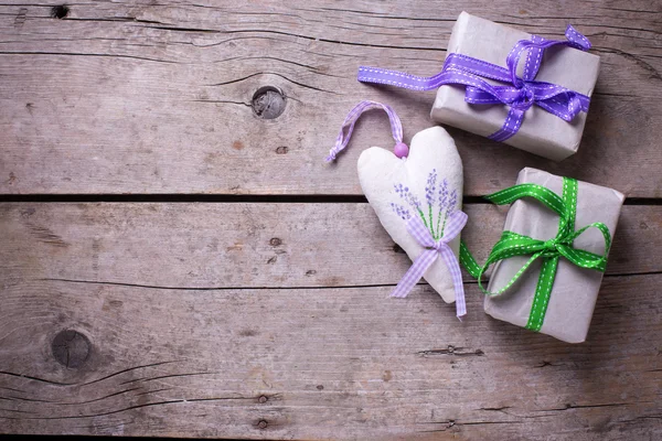 Gift boxes and decorative heart — Stock Photo, Image