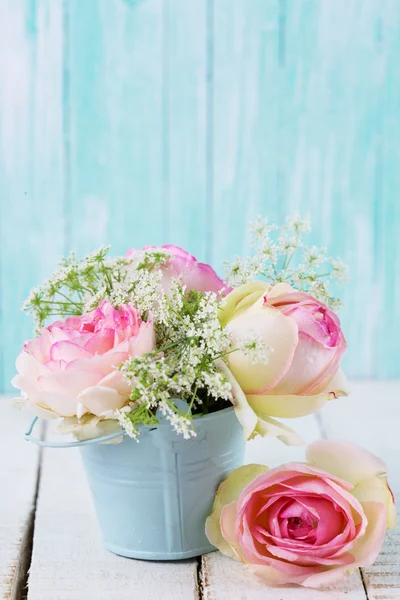 Flowers in bucket — Stock Photo, Image