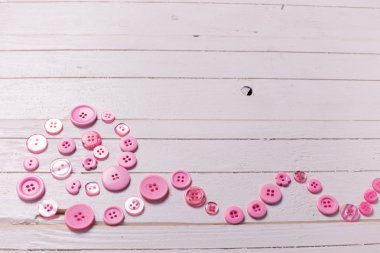 Sarmal pembe düğmeleri