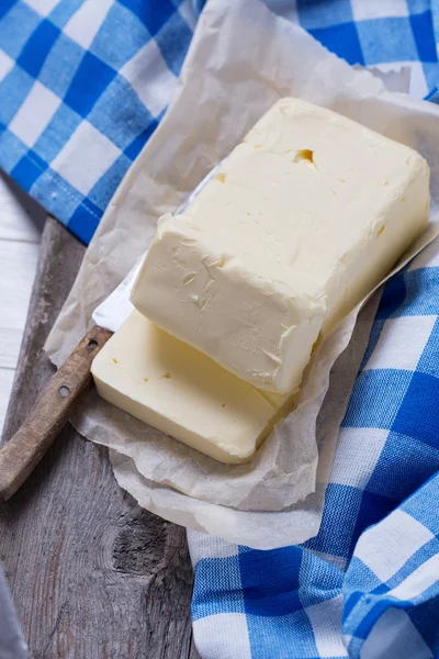 Fresh butter on wooden board. — Stock Photo, Image