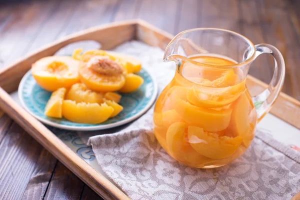 Stewed summer fruits in pitcher — Stock Photo, Image