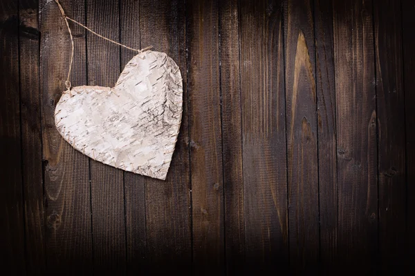 Corazón sobre fondo de madera. — Foto de Stock