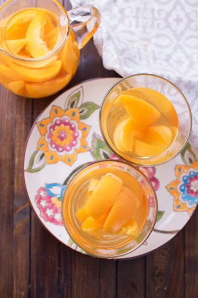 Stewed summer fruits in pitcher — Stock Photo, Image