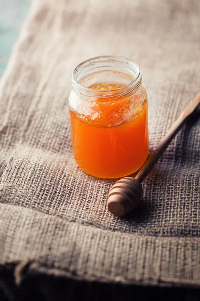 Fresh honey in glass jar — Stock Photo, Image