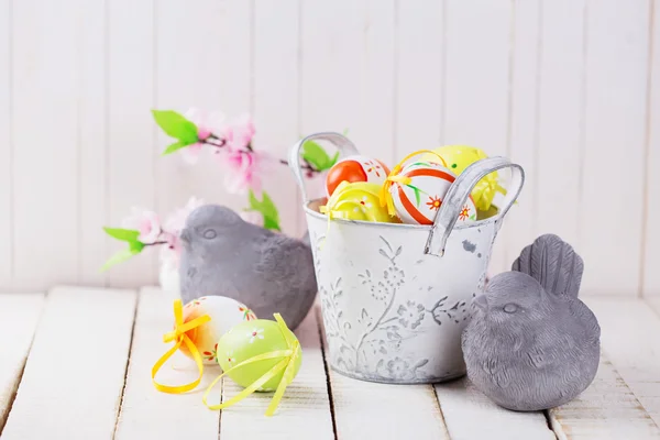 Colorful easter eggs  and stone birds — Stock Photo, Image