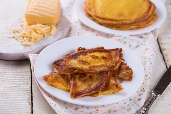 Pancakes or crepes with cheese — Stock Photo, Image