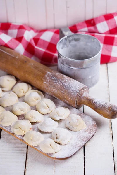 Dumplings with meat on wooden background — Stock Photo, Image