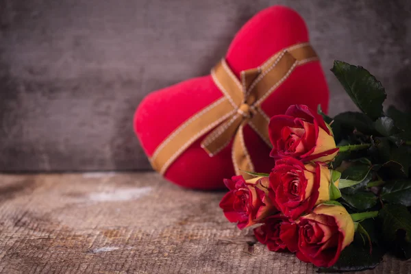 Fresh flowers and box with present — Stock Photo, Image