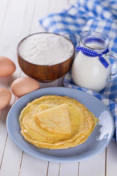 Pancakes or crepes and ingredients — Stock Photo, Image