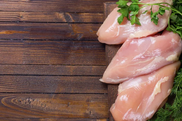 Raw  chicken meat  on wooden table