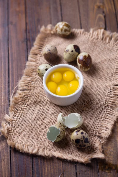 Quail eggs on wooden background — Stock Photo, Image