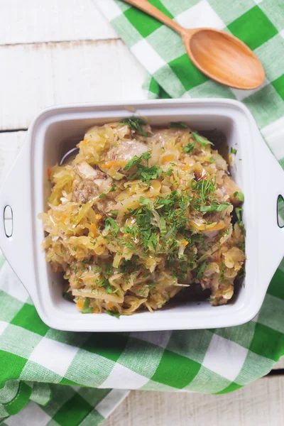 Homemade sauerkraut in bowl with herbs — Stock Photo, Image