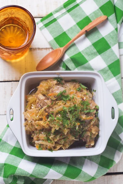 Homemade sauerkraut in bowl with herbs — Stock Photo, Image