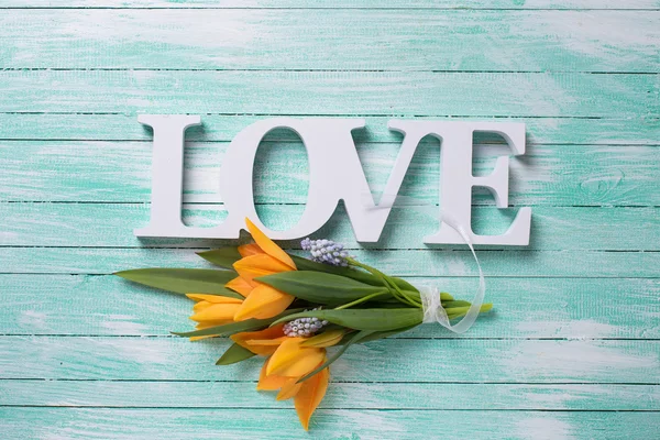 Fresh flowers and word love — Stock Photo, Image