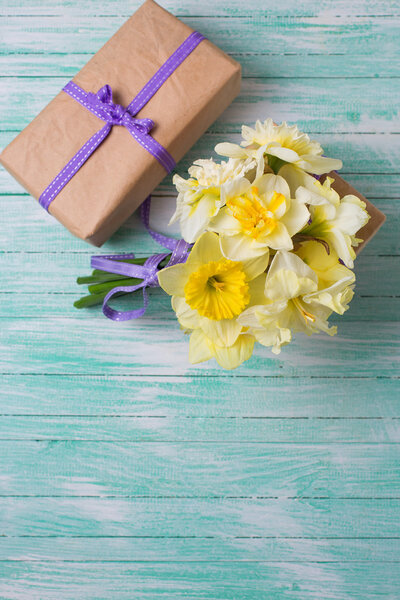 Bunch of spring flowers and gift box