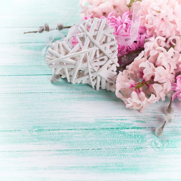 Background with fresh flowers hyacinths and decorative heart — Stock Photo, Image