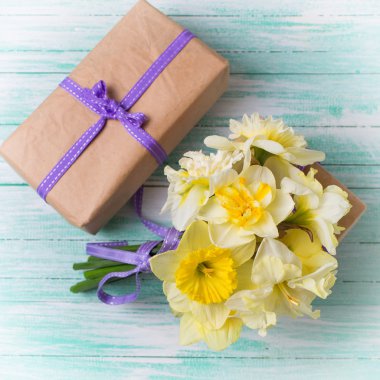Bunch of spring flowers and gift box clipart