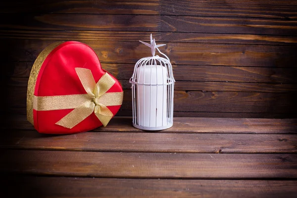 Festive gift box and candle — Stock Photo, Image