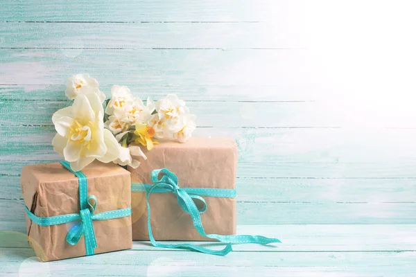 Festive gift boxes with ribbon and flowers — Stock Photo, Image