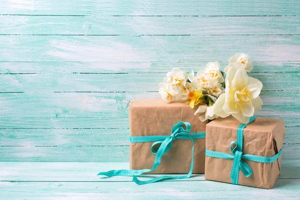 Festive gift boxes with ribbon and flowers — Stock Photo, Image