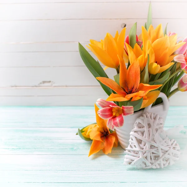 Fresh tulips and decorative heart — Stock Photo, Image