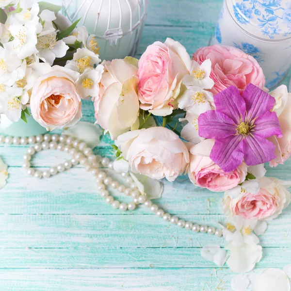 Roses, jasmine and clematis flowers — Stock Photo © daffodil 85193542