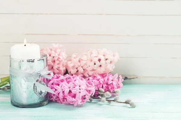 Flowers hyacinths and candle — Stock Photo, Image