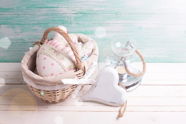 Decorative hearts, candle, basket — Stock Photo, Image