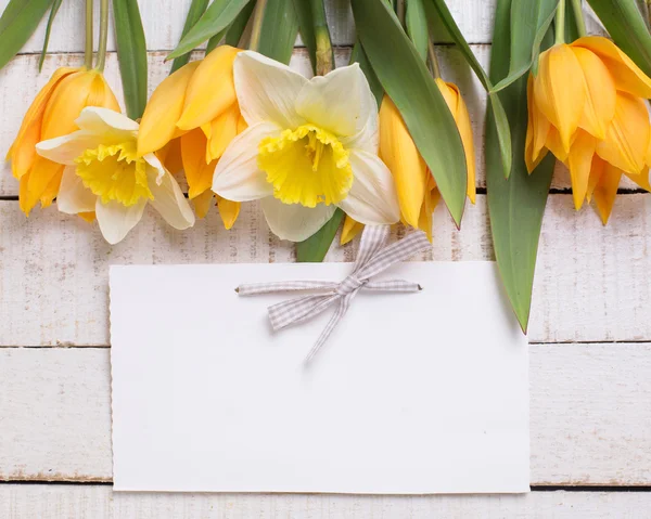 Fresh flowers and empty tag — Stock Photo, Image