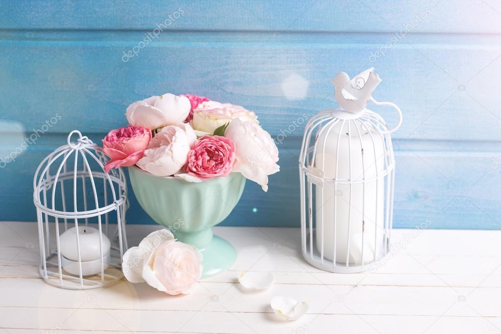 Pastel roses in turquoise vase