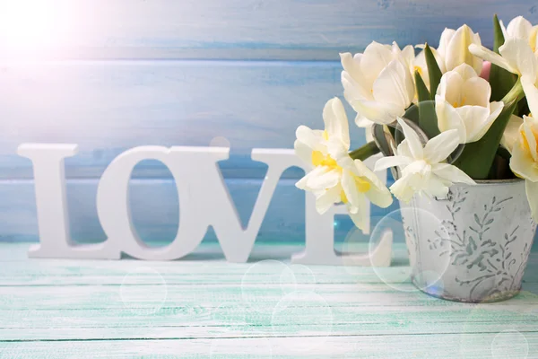 Flowers in bucket and word love — Stock Photo, Image